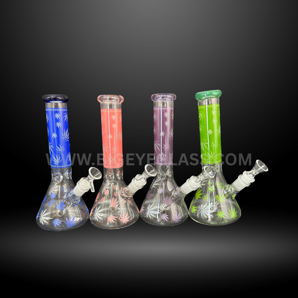 Set of clear glass beaker bongs with colored necks and leaf print designs. Wholesale 10 inch water pipes for smoke shops and distributors.