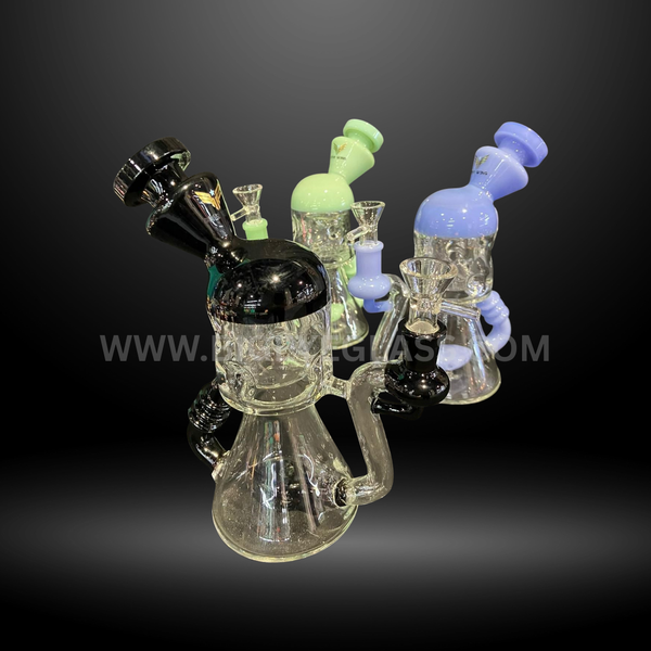 Glass bongs with colored tops in black, green, and blue. Durable design with wide base and premium quality. Wholesale water pipes collection.