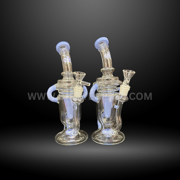 Set of two clear glass recycler bongs with light blue accents. High-quality wholesale water pipes for smooth smoking, ideal for head shops and distributors.