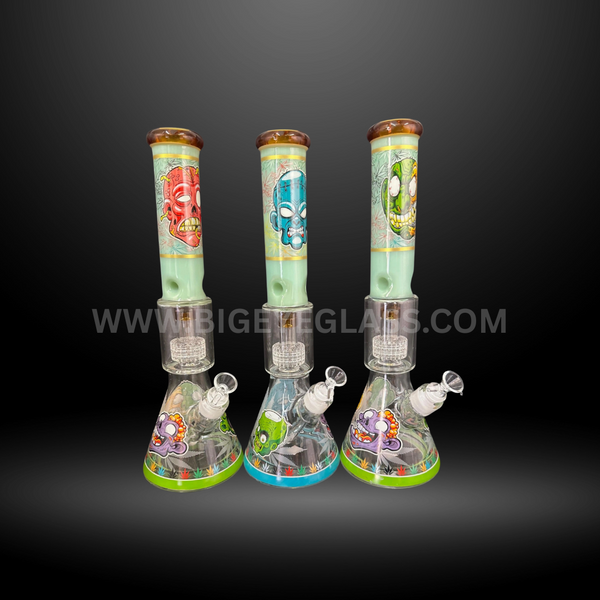 Set of three cartoon skull design beaker glass bongs with colorful artwork and sturdy bases. Wholesale smoking accessories for head shops and resellers.