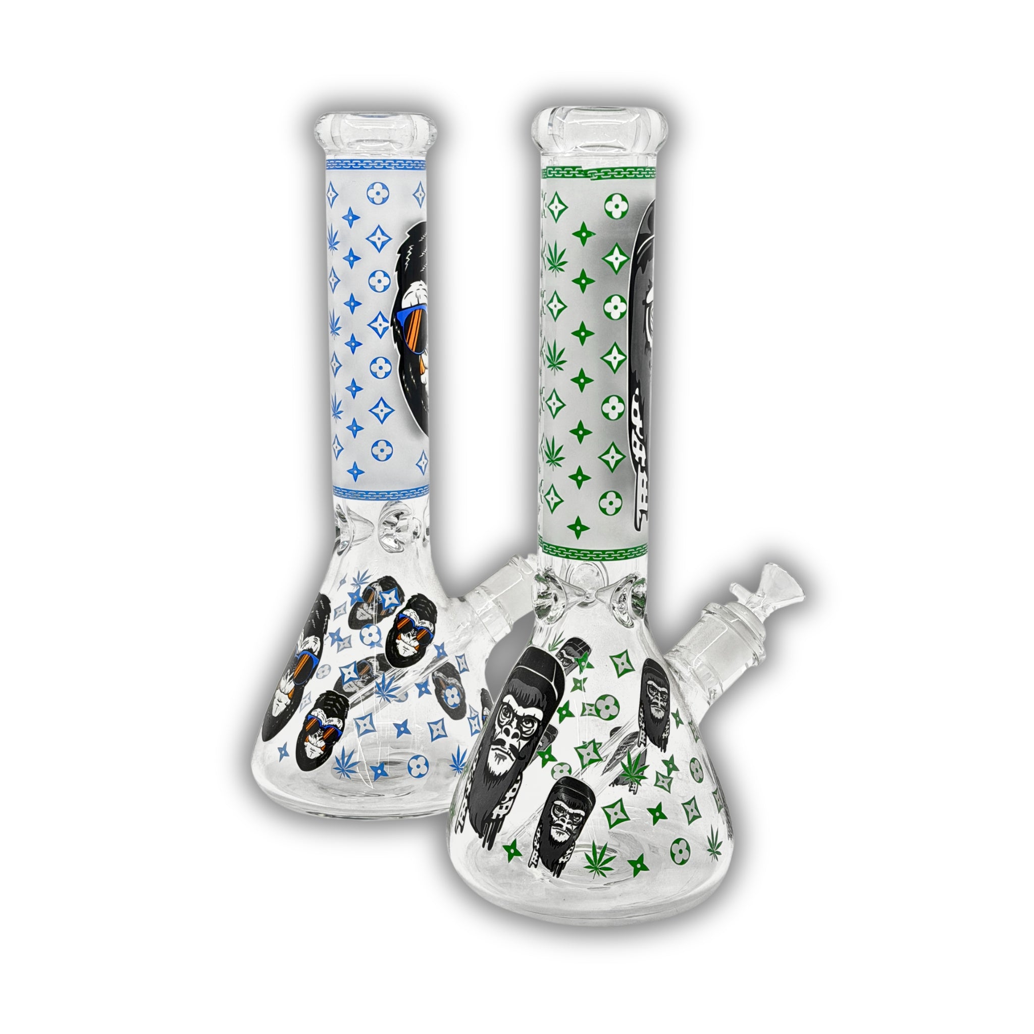 Clear glass beaker bong with monkey face graphics, designer-inspired repeating pattern print, cannabis leaf accents, and colored neck designs in blue and green.