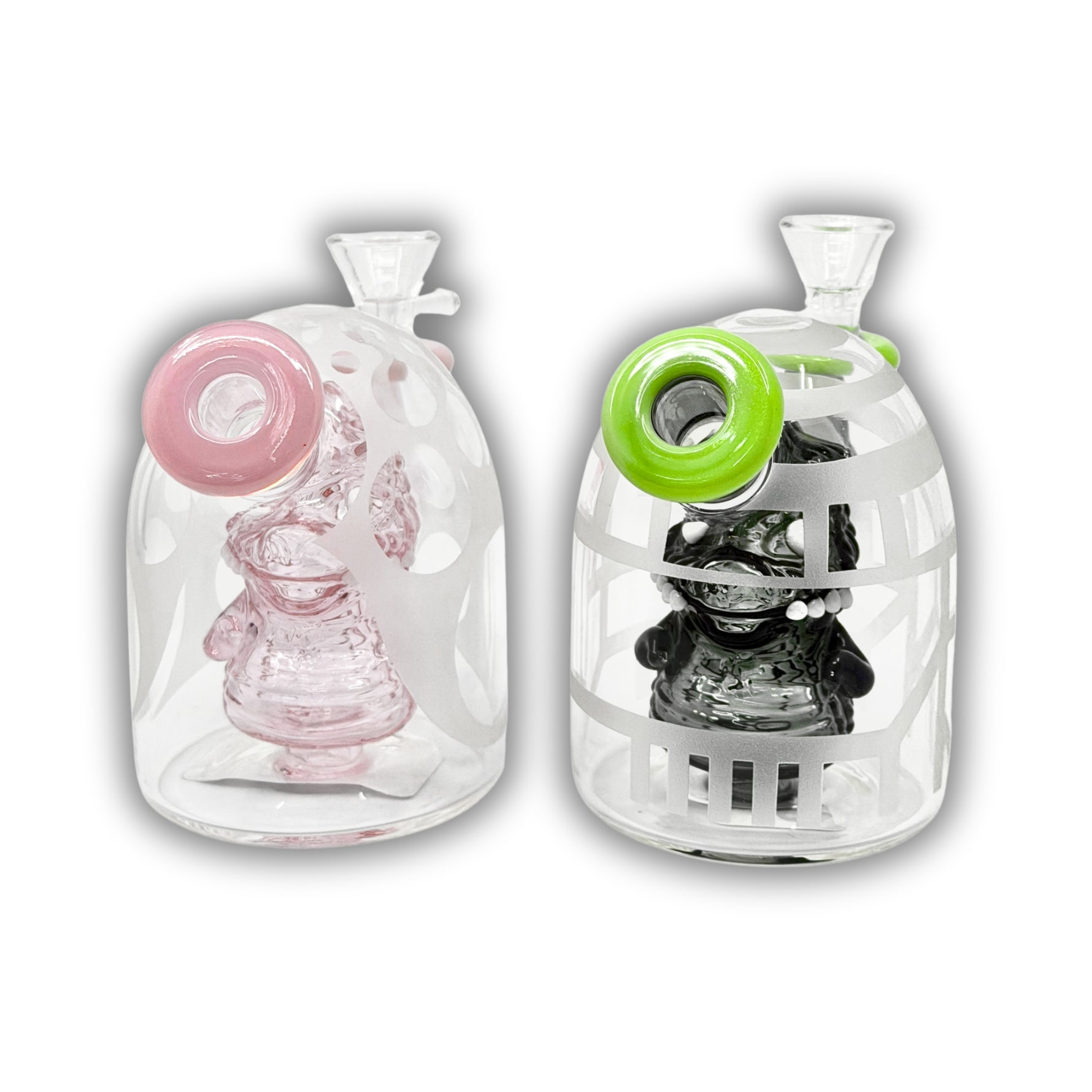 Compact glass dab rig featuring an enclosed character skull perc inside a frosted dome chamber with colorful side mouthpiece accents.