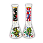 Clear glass beaker bong featuring green alien artwork, galaxy and planet graphics, cannabis leaf accents, and black space-themed neck print.