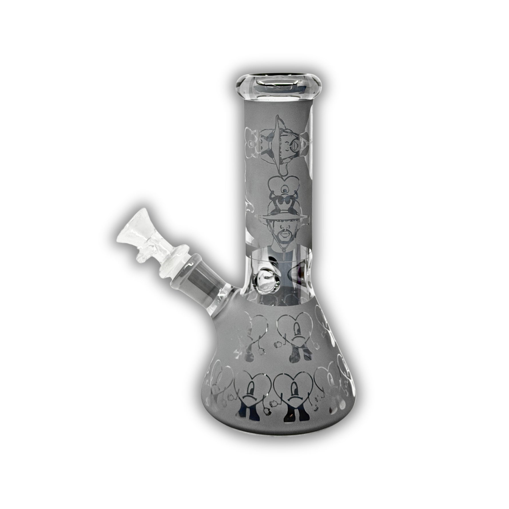 Assorted mini glass beaker bongs featuring frosted finishes, metallic electroplated colors, engraved paisley and skull patterns, cannabis leaf graphics, and decorative etched designs.