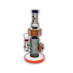Decorative glass bong with sandblasted tribal artwork, stacked skull totem design, and colorful accent detailing on a straight tube body.