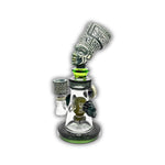 Artistic glass dab rig featuring an ancient queen head sculpture, engraved tribal details, and matching decorative bowl accents.