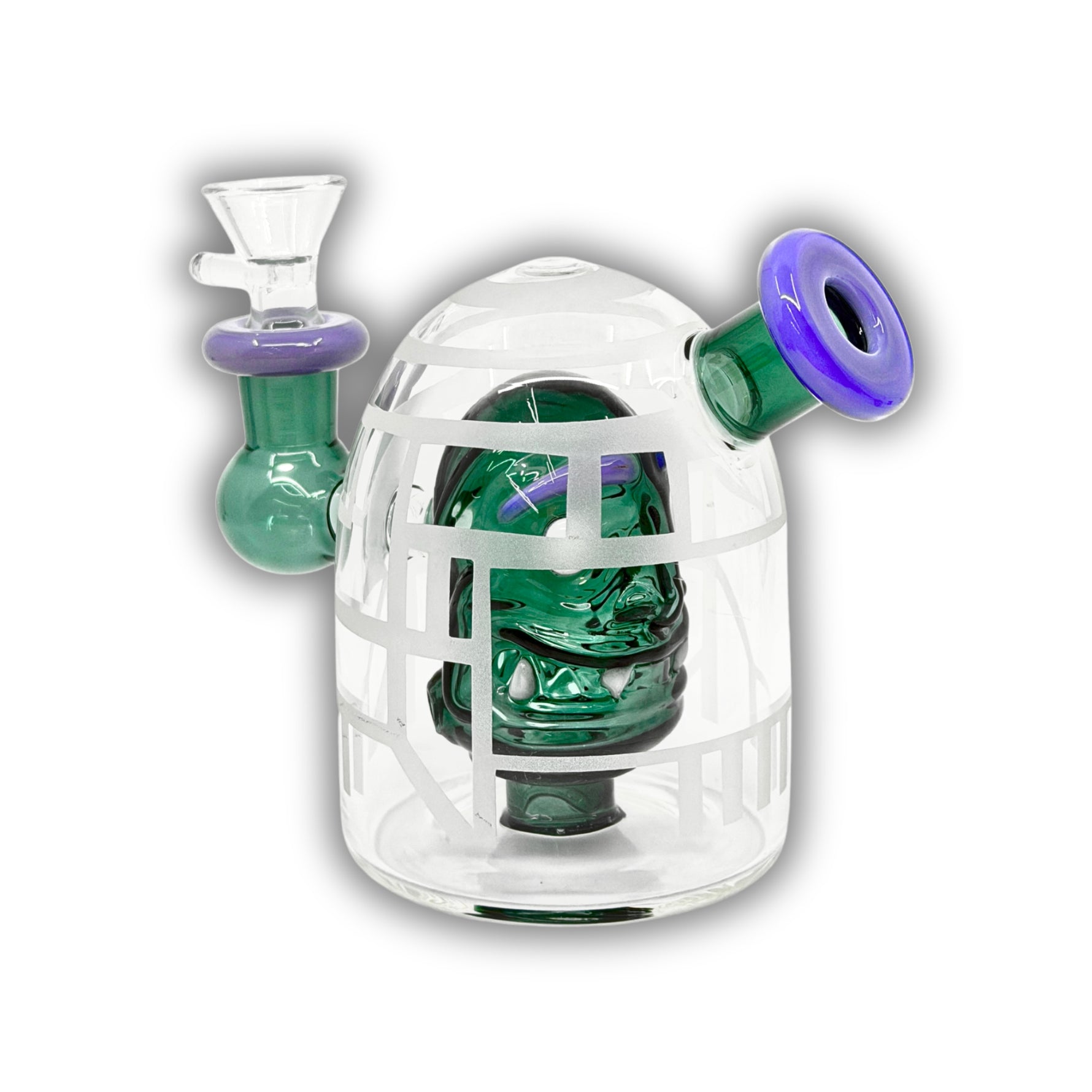 Mini glass dab rig featuring a detailed skull percolator inside a sandblasted dome chamber with colored side mouthpiece accents.