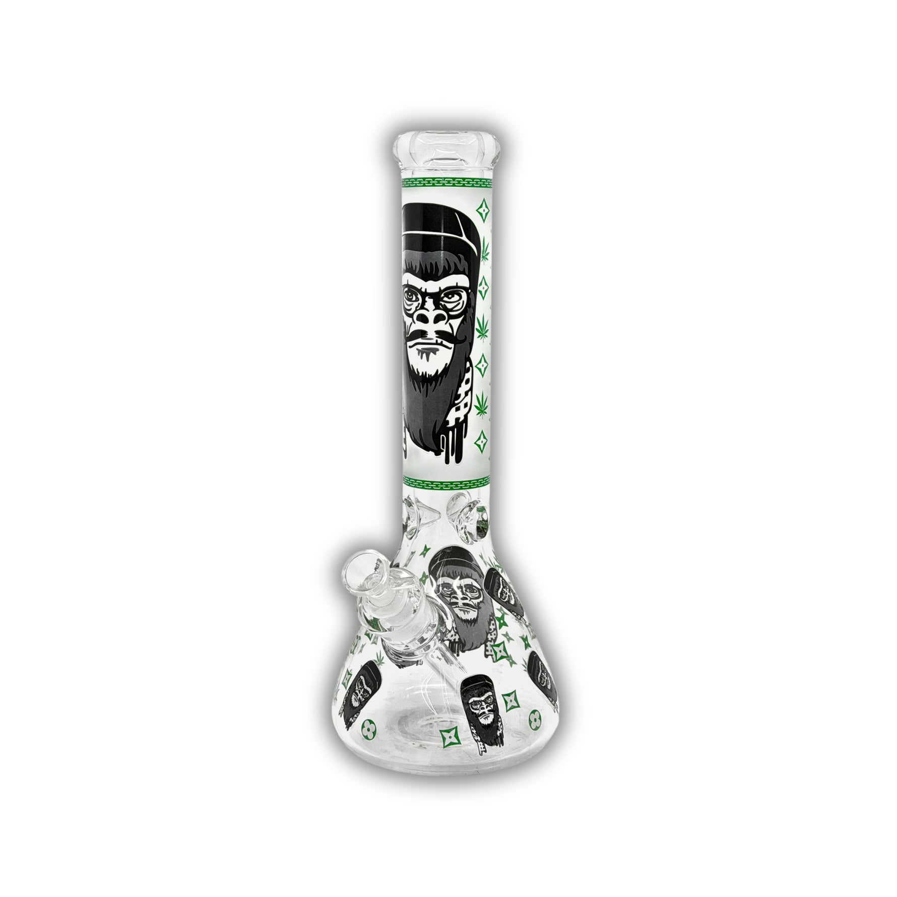 Clear glass beaker bong with monkey face graphics, designer-inspired repeating pattern print, cannabis leaf accents, and colored neck designs in blue and green.