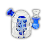 Mini glass dab rig featuring a detailed skull percolator inside a sandblasted dome chamber with colored side mouthpiece accents.