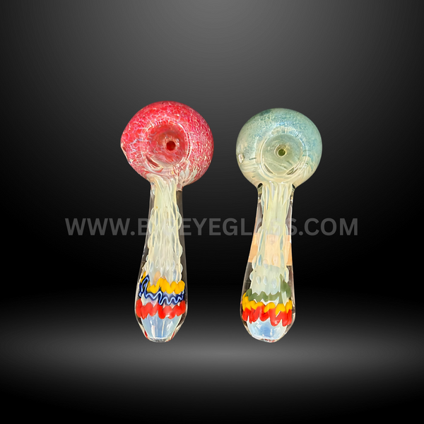 Assorted 4-inch frit glass hand pipes with colorful red and blue bowls, flowing frit design, and multicolor base accents. Wholesale smoking pipes for smoke shops and head shops.