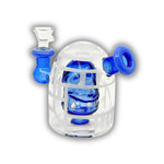 Mini glass dab rig featuring a detailed skull percolator inside a sandblasted dome chamber with colored side mouthpiece accents.