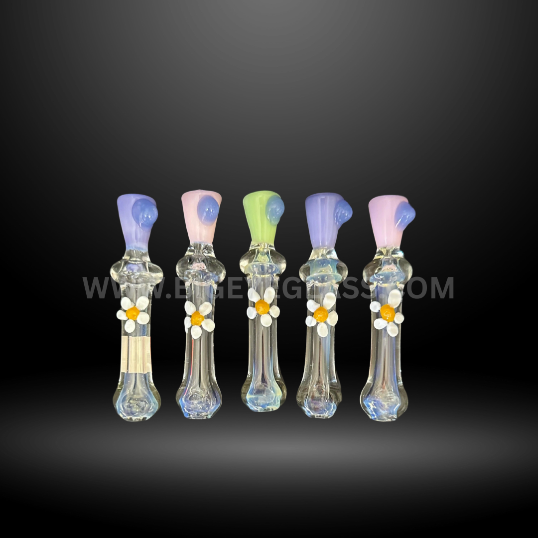 Assorted 5-inch glass chillum smoking pipes with pastel-colored mouthpieces and decorative flower accents. Wholesale hand pipes for smoke shops and head shops.
