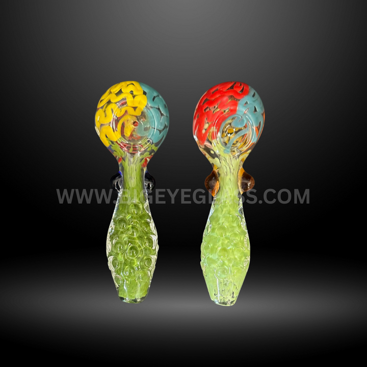 Pair of 4-inch glass hand pipes featuring honeycomb textured handles with red and yellow swirl bowls. Wholesale smoking accessories for head shops.