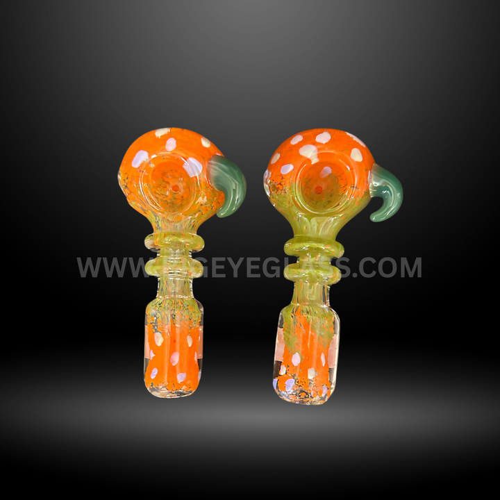 Set of 5-inch orange glass hand pipes with white polka dots and green side accents. Durable wholesale smoking pipes for smoke shops and head shops.