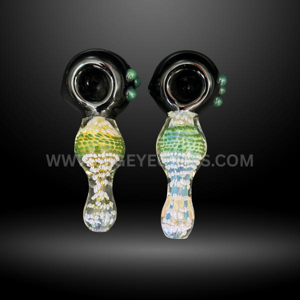 Pair of 5-inch glass hand pipes featuring black bowls with green side marbles and mosaic-style handles in green, yellow, and white patterns.