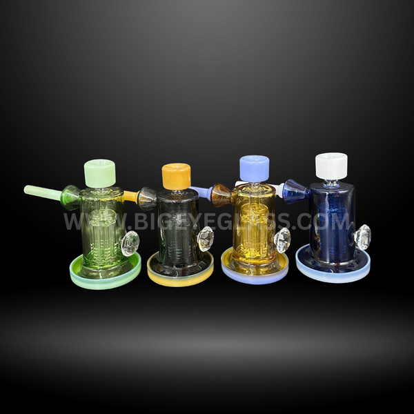 Set of four 5 inch colorful glass percolator rigs with matching accents and sturdy bases. Wholesale water pipes for smooth hits, perfect for smoke shops.