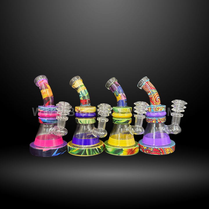 Set of four 6 inch colorful patterned glass mini bongs with bent neck design and round base. Wholesale water pipes for smoke shops and distributors.