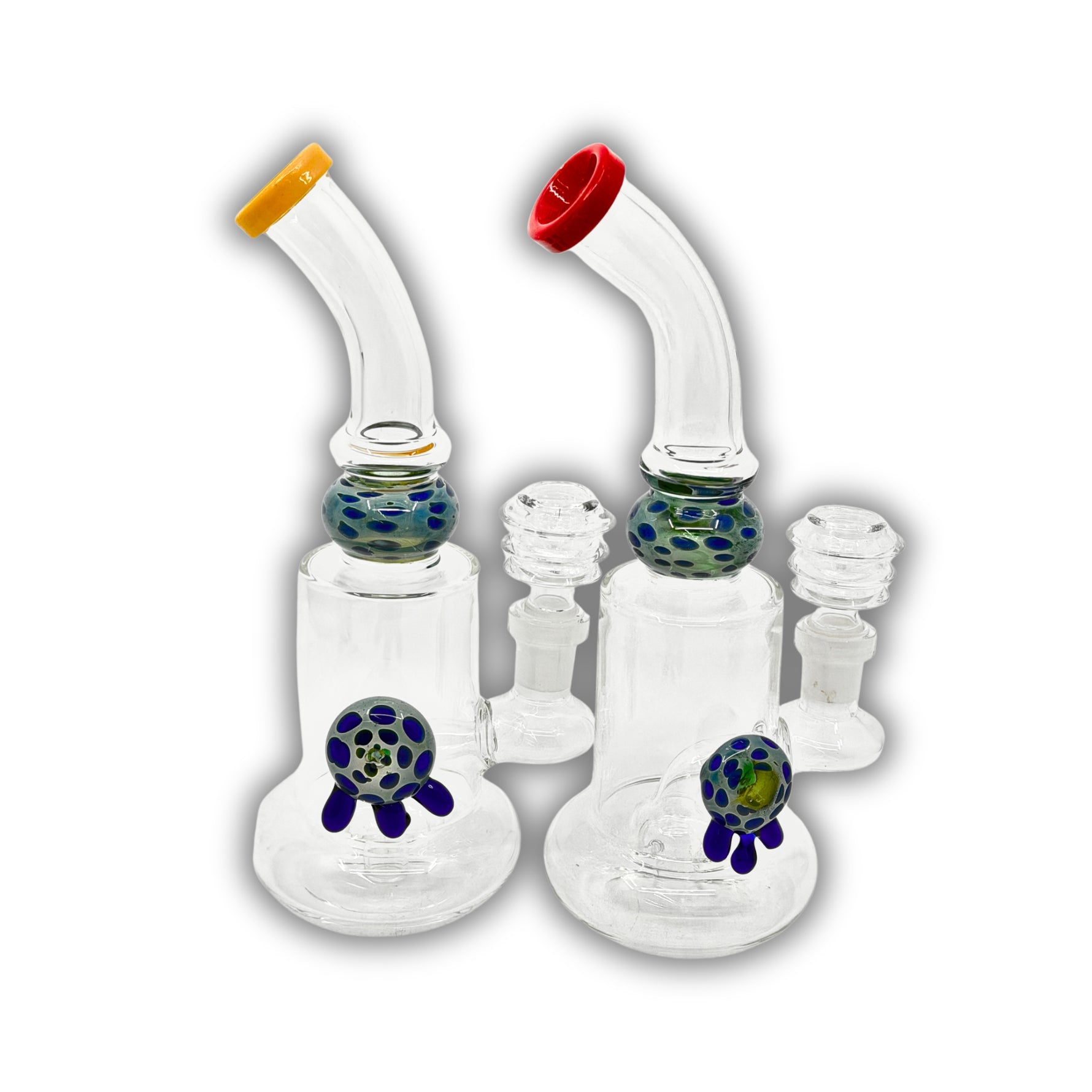 Compact glass dab rig featuring a bubble chamber with decorative turtle accent and spotted glass marble detail, available with colored mouthpieces.