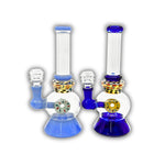 Glass water pipe with donut-style percolator, bubble chamber, speckled neck detail, and colored base and joint.