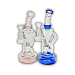 Glass recycler water pipe featuring a double chamber design with angled neck and colored base accents.