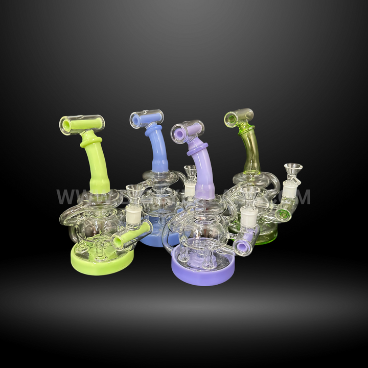 Set of colorful recycler glass rigs with pastel accents in green, blue, and purple. High-quality wholesale dab rigs and water pipes for head shops.