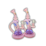 Pink and purple dual recycler glass water pipe with looped chamber design and angled neck.