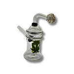 Clear glass dab rigs with printed cartoon graphics and spinner caps in assorted colors, featuring compact chamber design.