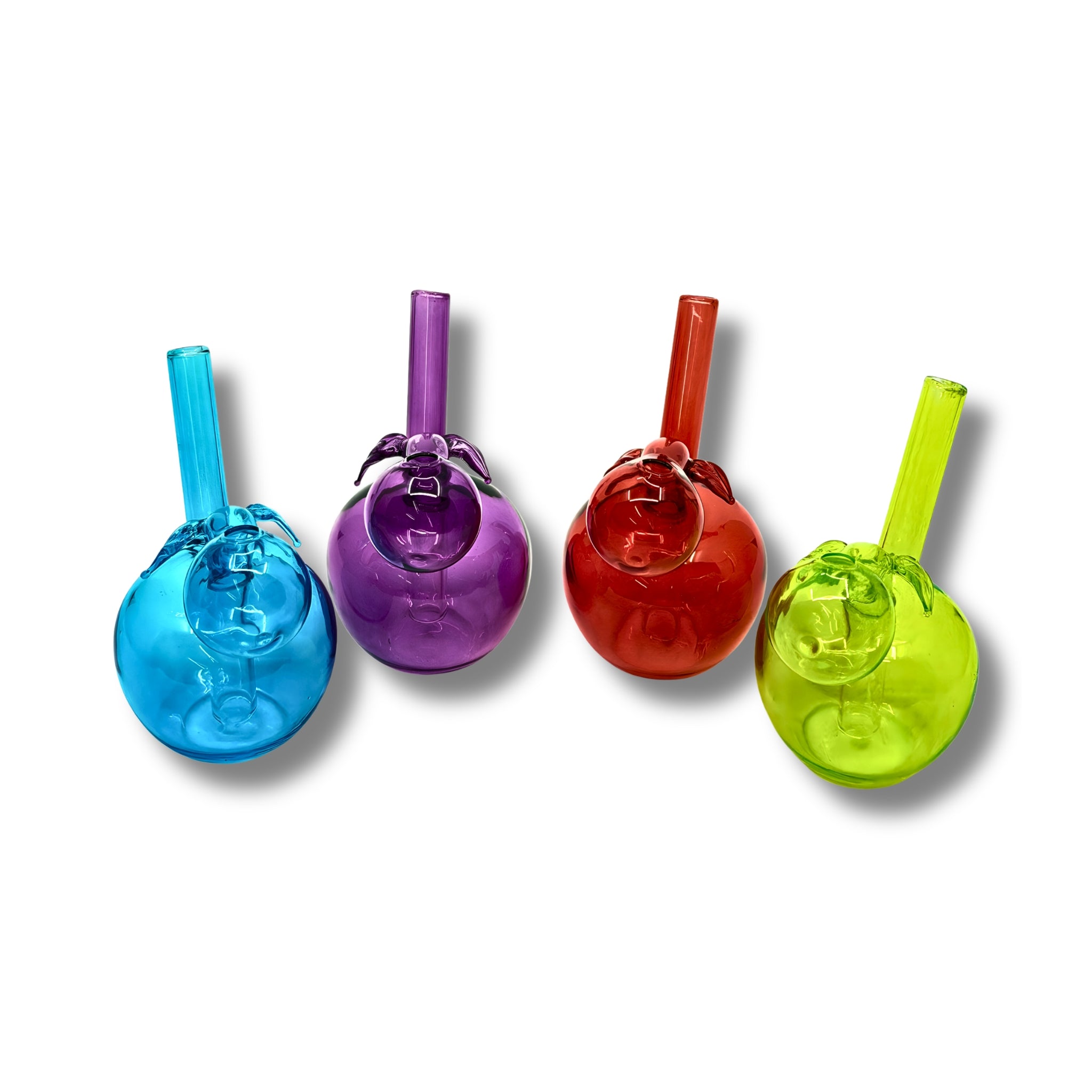 Colorful glass oil burner pipes shaped like apples in blue, purple, red, and green with round body and leaf detail.