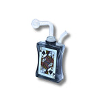 Glass oil burner  designed like playing cards with spade symbols in black, green, amber, and pink colors.