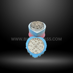 Blue cake-shaped herb grinders in heart and square designs with detailed frosting tops and layered colors. Fun novelty grinders for smoking accessories