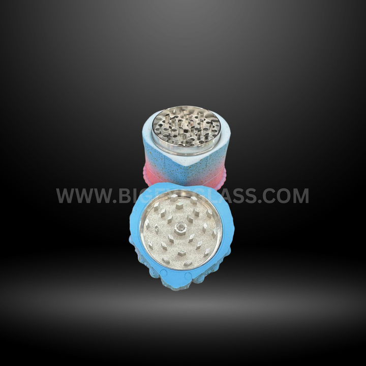 Blue cake-shaped herb grinders in heart and square designs with detailed frosting tops and layered colors. Fun novelty grinders for smoking accessories