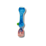 Assorted fumed glass chillum pipes with colorful swirl patterns in red, yellow, blue, and green.