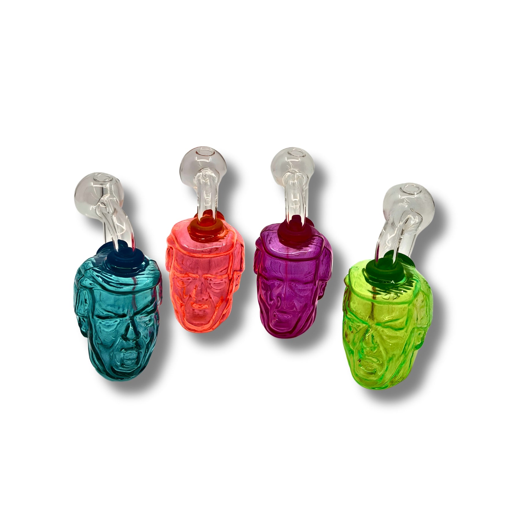 Colorful glass oil burner pipes shaped like human heads in teal, orange, pink, and green with detailed facial design.
