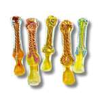 Hand-blown glass chillum pipes with fumed yellow base and colorful swirl patterns inside.