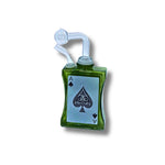 Glass oil burner  designed like playing cards with spade symbols in black, green, amber, and pink colors.