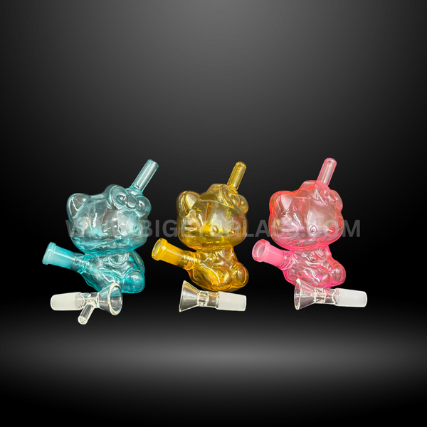 Set of colorful Hello Kitty-inspired glass water pipes in blue, yellow, and pink. Cute novelty wholesale bongs for smoke shops and distributors.