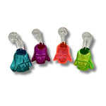 Colorful glass oil burner pipes shaped like helmeted character faces in teal, purple, orange, and green.