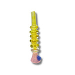Transparent yellow glass chillum pipes with stacked ring texture and colorful base accents.