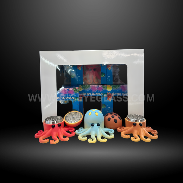 Colorful octopus-shaped metal herb grinders with display box. Fun ocean-themed tobacco grinders in red, blue, orange, and brown for wholesale or retail.