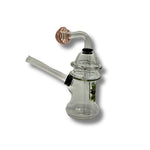 Clear glass dab rigs with printed cartoon graphics and spinner caps in assorted colors, featuring compact chamber design.
