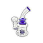 Compact glass dab rig featuring a double chamber base and colored accent neck in purple and green variations.