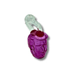 Colorful glass oil burner pipes shaped like human heads in teal, orange, pink, and green with detailed facial design.