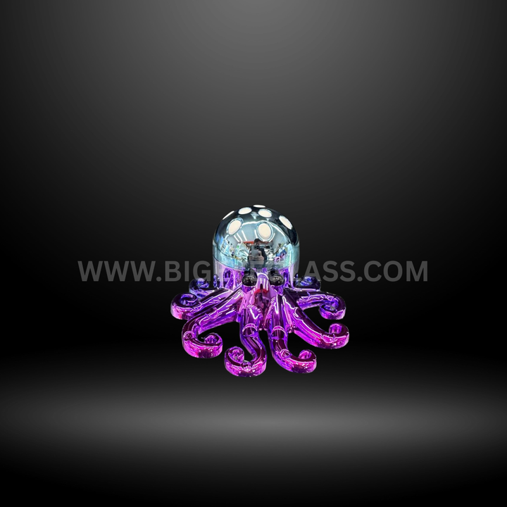 Shiny octopus-shaped metal herb grinder in purple color displayed with retail packaging. Durable 4-piece design for smooth grinding.