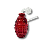Grenade-shaped glass oil burner pipes in green, red, blue, purple, and amber colors with textured body design.