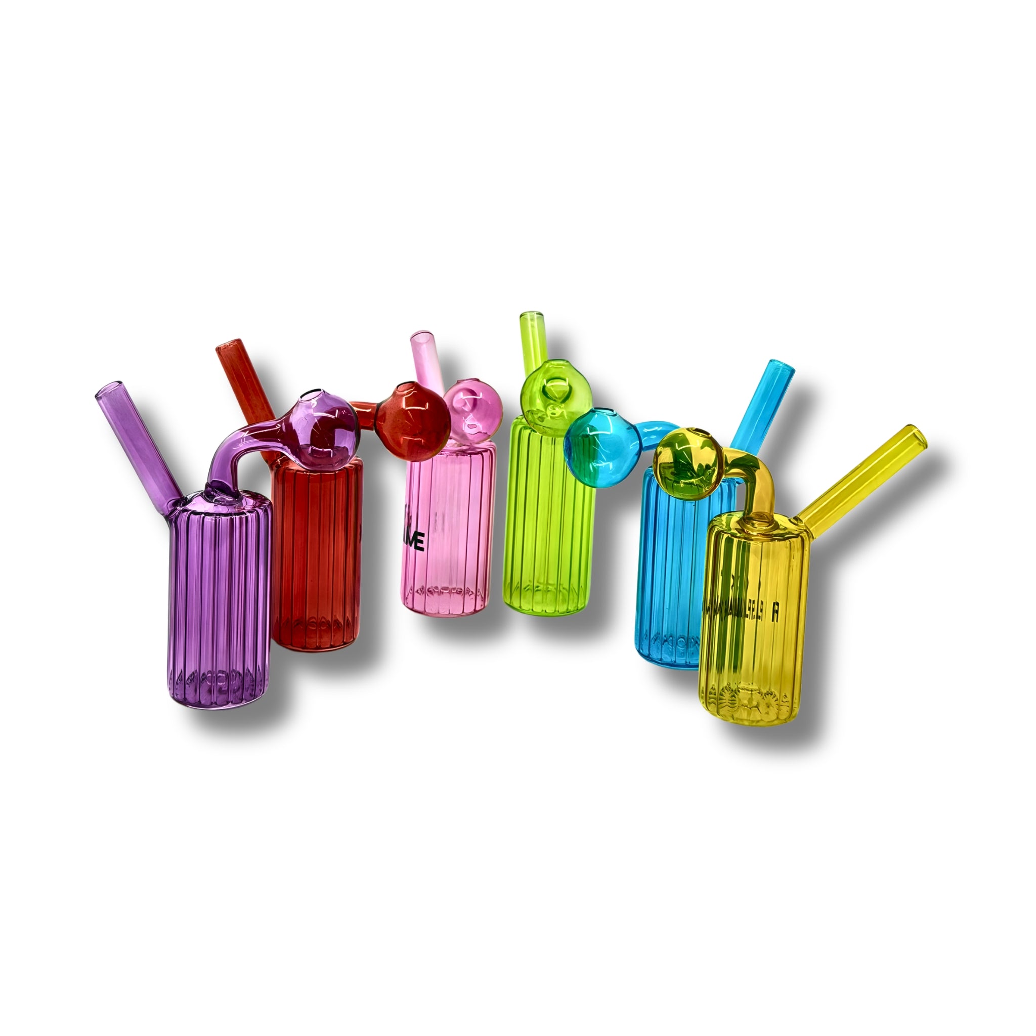 Ribbed cylindrical glass oil burner pipes with side bubble chamber in multiple transparent colors including purple, red, pink, green, blue, and yellow.
