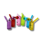 Ribbed cylindrical glass oil burner pipes with side bubble chamber in multiple transparent colors including purple, red, pink, green, blue, and yellow.