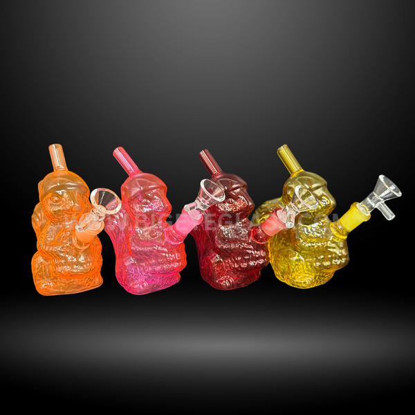 Set of colorful gnome-shaped glass water pipes in orange, pink, red, and yellow. Fun novelty wholesale bongs for smoke shops and distributors.