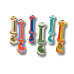 Glass chillum pipes with striped swirl patterns in multiple colors including red, blue, green, white, and yellow.
